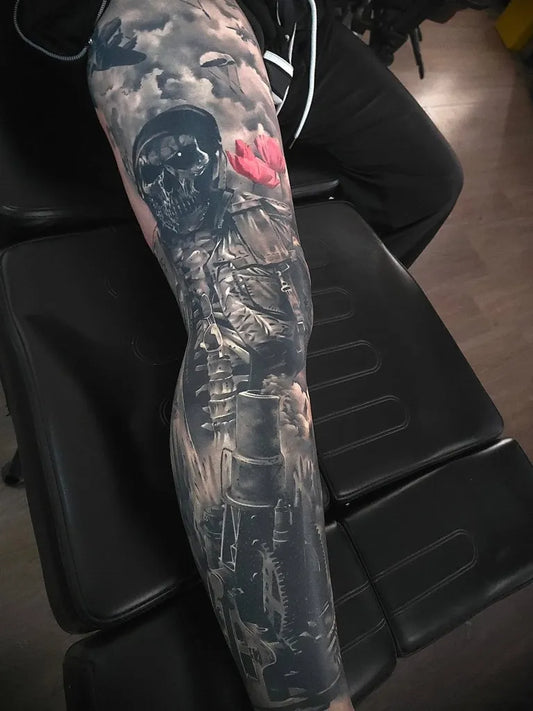 Big Black and Grey Skull Rose Armor Military Tattoo on Men Thigh by @crankycraigstattoos