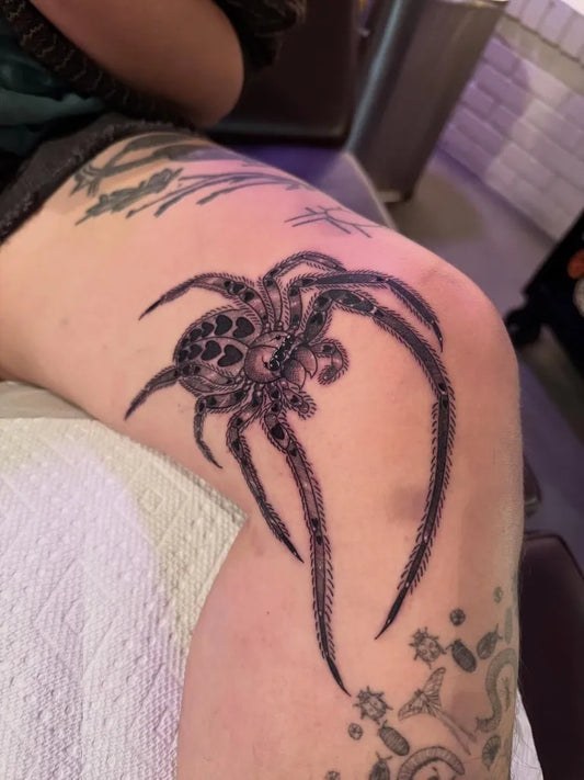 Big Black and Grey Spider on Women Knee Tattoo by @sadpuppytattoo