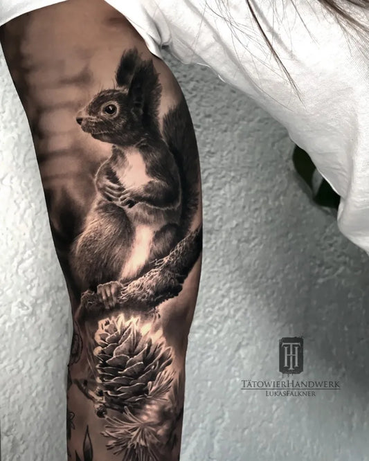 Big Black and Grey Squirrel and Pine Cone Tattoo on Women Thigh by @th_lukas_falkner