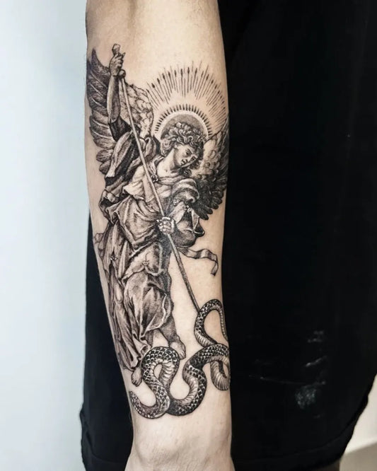 Big Black and Grey St Michael Slaying Dragon Tattoo on Men Arm by @mantletattoo