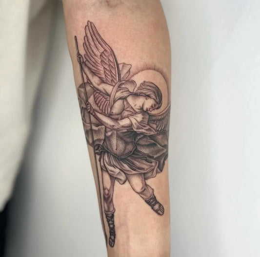 Big Black and Grey St Michael Slaying Dragon Tattoo on Men Arm by @marigold.tattoo