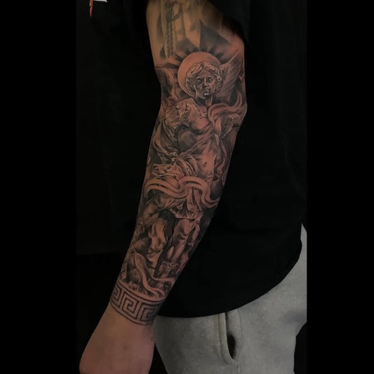 Big Black and Grey St Michael Slaying Dragon Tattoo on Men Arm by @sernatattoos