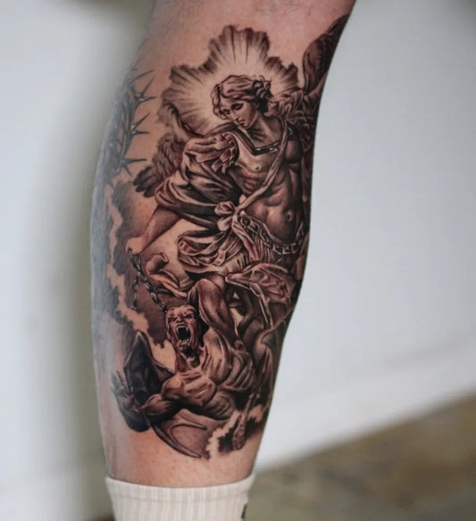 Big Black and Grey St Michael Slaying Dragon Tattoo on Men Leg by @luna.inkk