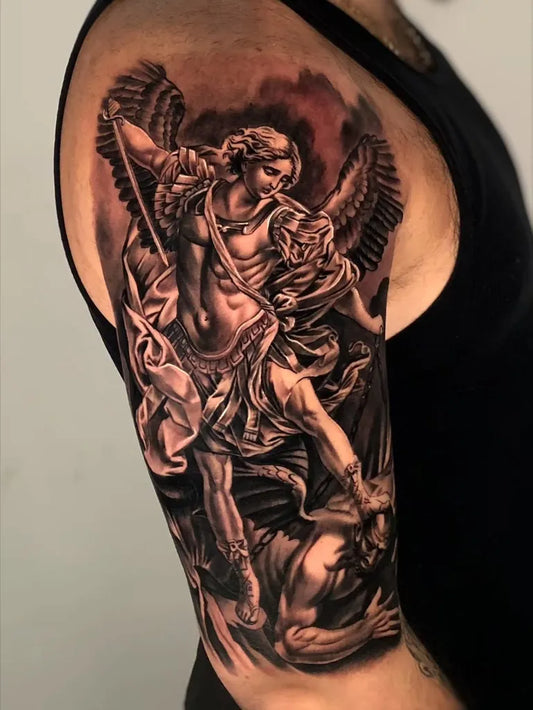 Big Black and Grey St Michael Slaying Dragon Tattoo on Men Shoulder by @mager_tattoos