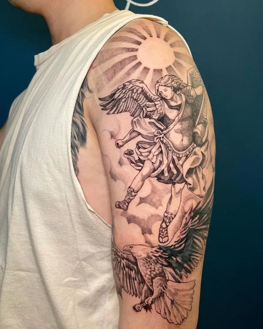 Big Black and Grey St Michael with Sun and Eagle Tattoo on Men Shoulder by @rio.sixtytwoink