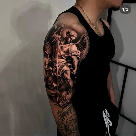 Big Black and Grey St Michael with Wings and Spear Tattoo on Men Shoulder by @centennialtattoogallery