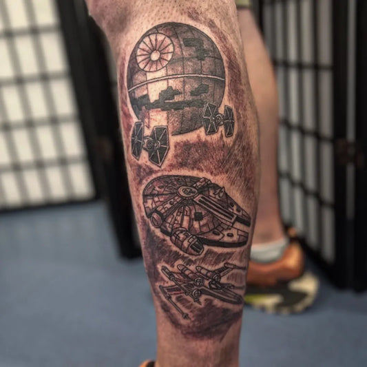 Big Black and Grey Star Wars Death Star Millennium Falcon TIE Fighters Tattoo on Men Leg by @morningstarportsmouth