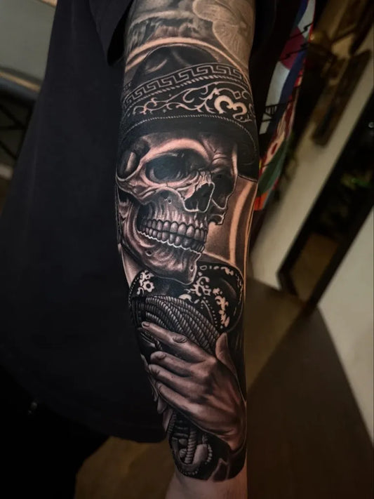 Big Black and Grey Sugar Skull with Sombrero and Rosary Tattoo on Men Arm by @art_by_brbz