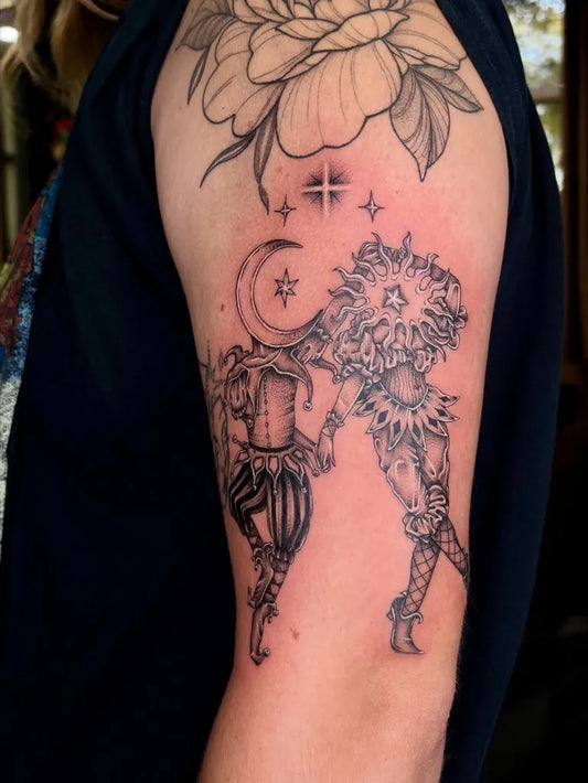 Big Black and Grey Sun and Moon Harlequin on Women Shoulder Tattoo by @carlysgnarlytattoos