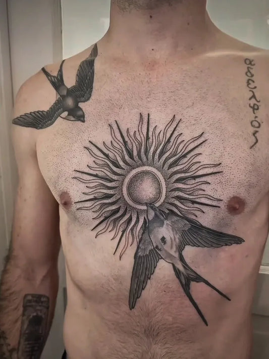 Big Black and Grey Sun and Swallows on Men Chest Tattoo by @undermythumbtattoos
