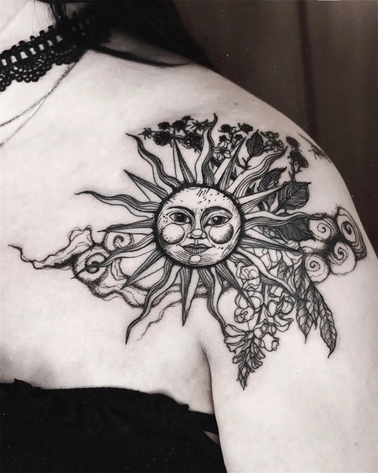 Big Black and Grey Sun with Flowers and Swirls on Women Shoulder Tattoo by @psychara_art