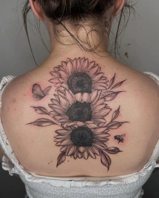 Big Black and Grey Sunflowers Butterflies and Bee on Women Back Tattoo by @albamartintattoo