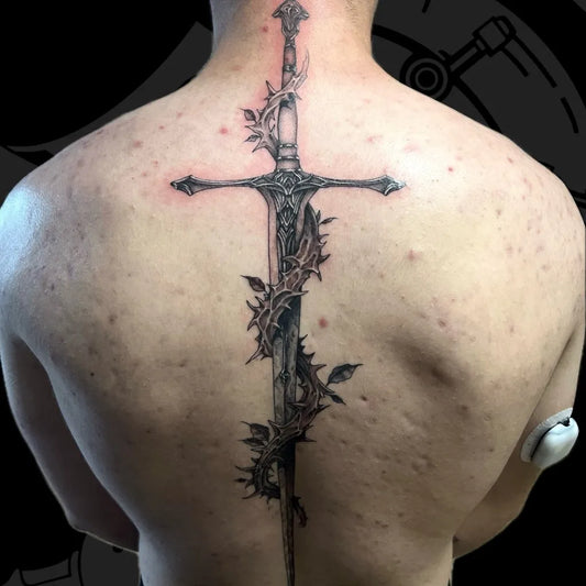 Big Black and Grey Sword with Vines and Thorns on Men Back Tattoo by @arkane_tattoos