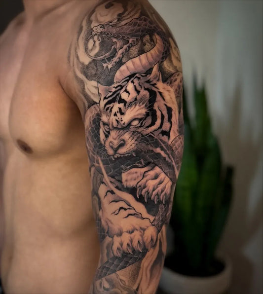 Big Black and Grey Tiger and Dragon on Men Arm Tattoo by @yanmotattoo