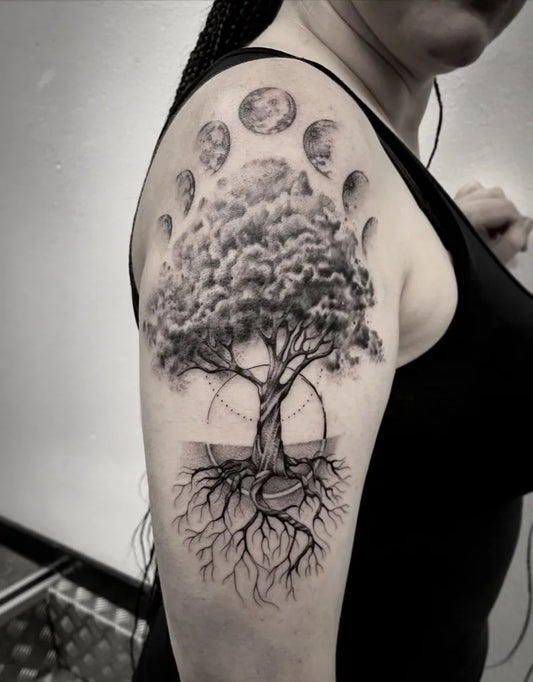Big Black and Grey Tree with Moons and Roots Tattoo on Women Shoulder by @inugato_art