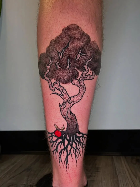 Big Black and Grey Tree with Roots and Red Accent Tattoo on Men Leg by @kaiaelise