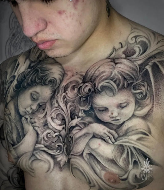 Big Black and Grey Two Cherubs with Floral Ornamentation on Men Chest Tattoo by @vahn_martinez