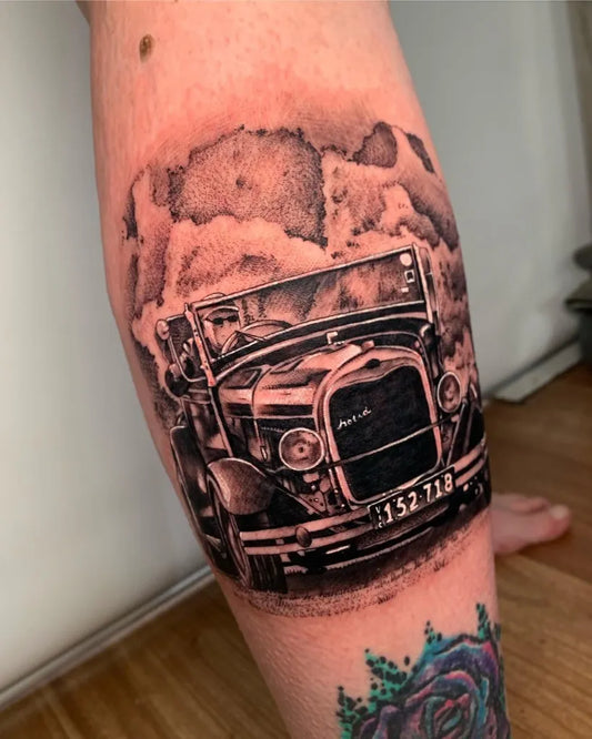 Big Black and Grey Vintage Car with Smoke Tattoo on Women Calf by @rachaeljones_tattoos