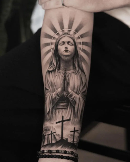 Big Black and Grey Virgin Mary Praying with Crosses Tattoo on Men Arm by @clemenstattoo