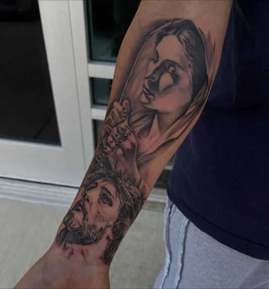 Big Black and Grey Virgin Mary and Jesus Tattoo on Men Arm by @oddjobtattoos