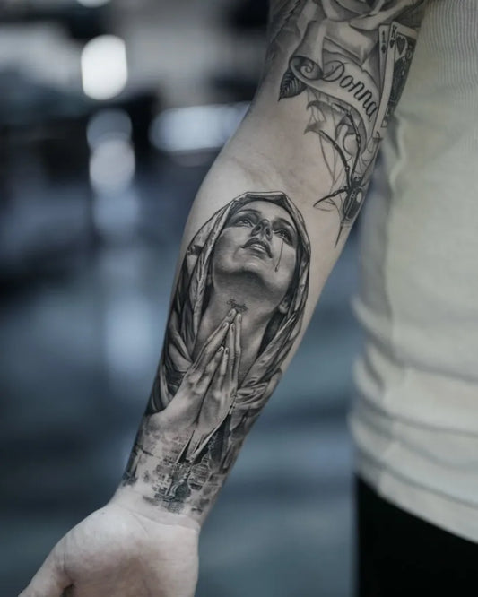 Big Black and Grey Virgin Mary with Banner Tattoo on Men Arm by @tattooist_bk