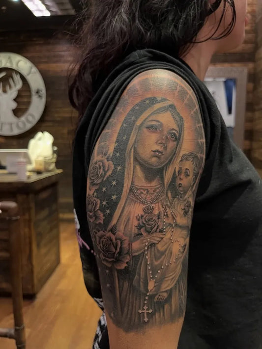 Big Black and Grey Virgin Mary with Child and Roses Tattoo on Women Arm by @legacytattooaz