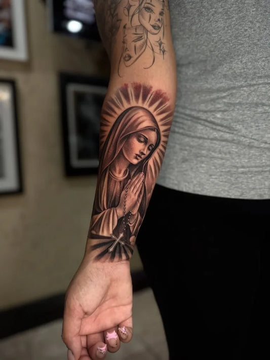 Big Black and Grey Virgin Mary with Halo and Praying Hands Tattoo on Women Arm by @steven_lowrider
