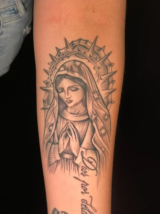 Big Black and Grey Virgin Mary with Halo and Praying Hands Tattoo on Women Arm by @tattoosbyorion