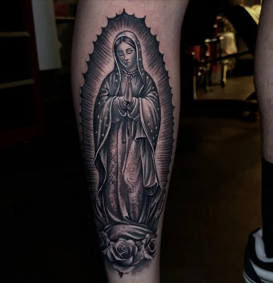 Big Black and Grey Virgin Mary with Roses Tattoo on Men Leg by @tribetattoodenver