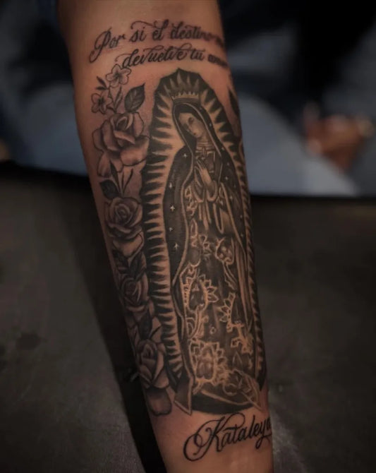 Big Black and Grey Virgin Mary with Roses and Script Tattoo on Women Arm by @nezjr_tattoolifestyle