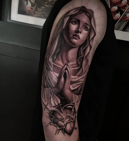 Big Black and Grey Virgin Mary with Sacred Heart Tattoo on Men Upper Arm by @hannahmcque.tattoo
