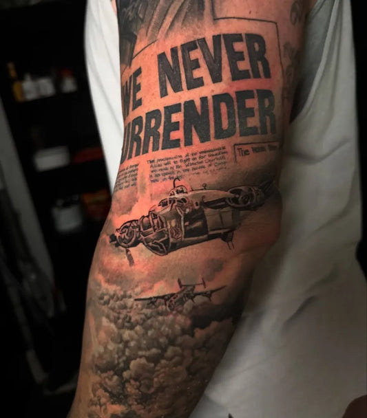 Big Black and Grey WWII Bomber and Text Military Tattoo on Men Arm by @keegankeelitattoos