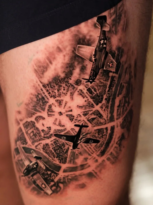 Big Black and Grey WWII Bombers and Cityscape Military Tattoo on Men Thigh by @chrispowelltattoos