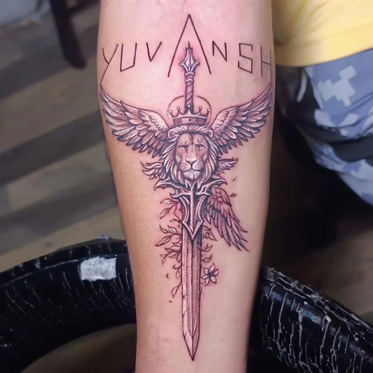 Big Black and Grey Winged Lion Sword on Men Arm Tattoo by @inkspace.studio