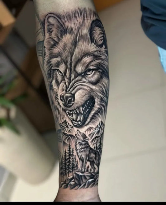 Big Black and Grey Wolf Landscape on Men Arm Tattoo by @carmanini.tattoo