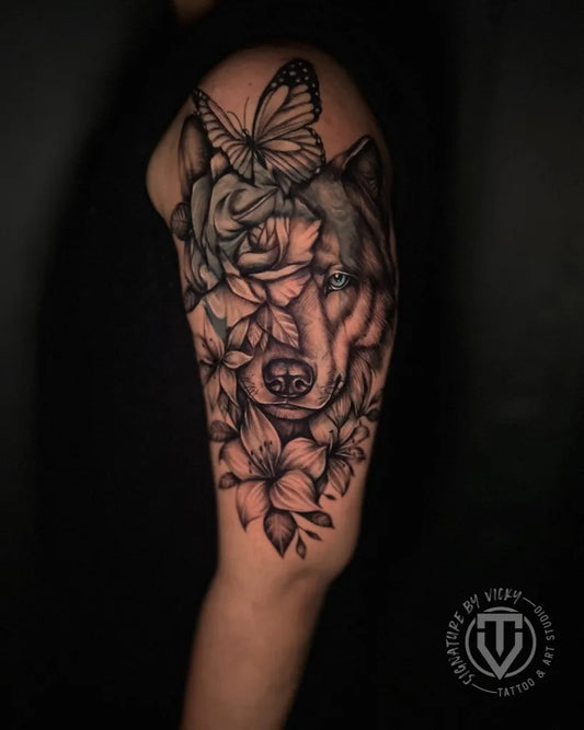 Big Black and Grey Wolf and Rose and Butterfly on Men Arm Tattoo by @signature_by_vicky