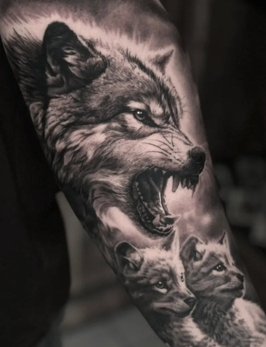 Big Black and Grey Wolf and Wolf Pups Tattoo on Men Arm by @goro_tattoo
