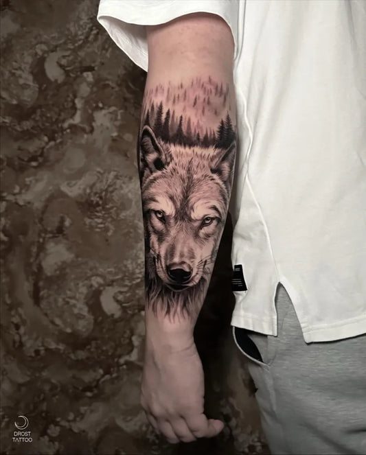 Big Black and Grey Wolf in Forest on Men Arm Tattoo by @drosttattoo