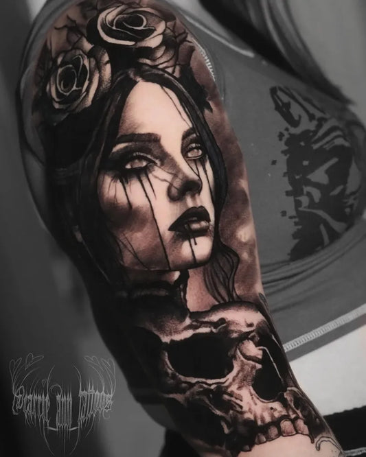 Big Black and Grey Woman with Roses and Skull Tattoo on Women Upper Arm by @carrie_ann_tattoos