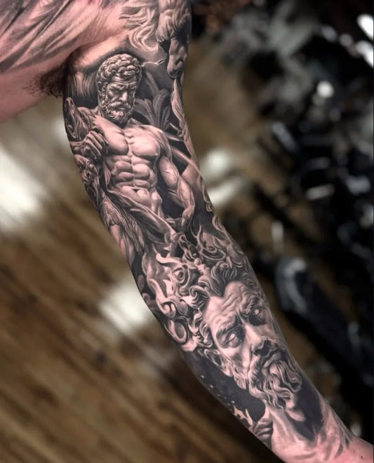 Big Black and Grey Zeus Figure Tattoo on Men Arm by @lamanigancetattootoronto