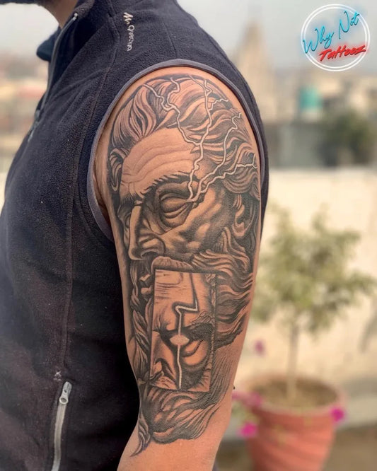 Big Black and Grey Zeus Portrait Tattoo on Men Bicep by @why.not.tattooz