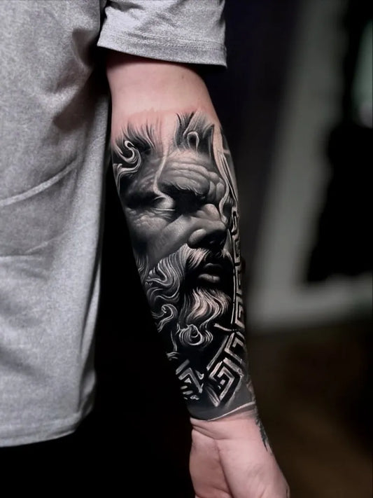 Big Black and Grey Zeus Portrait with Beard and Greek Key Pattern Tattoo on Men Arm by @kohstyle