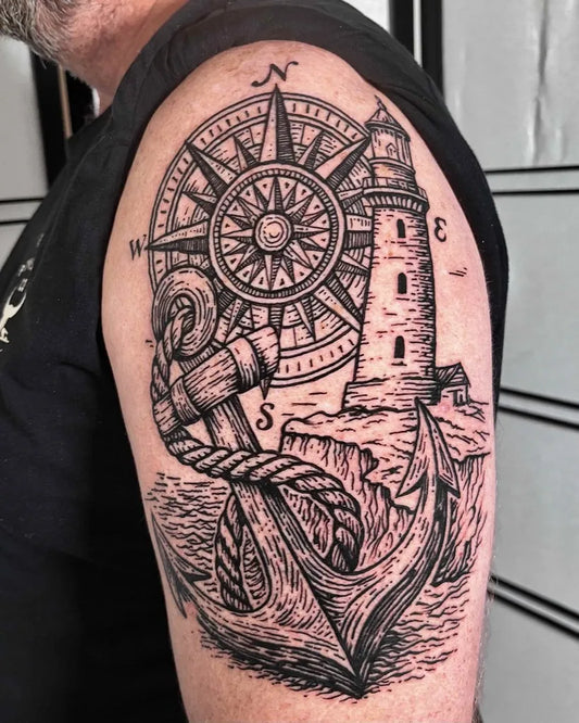 Big Blackwork Anchor Compass Lighthouse Tattoo on Men Shoulder by @jai.gilchristtattoo