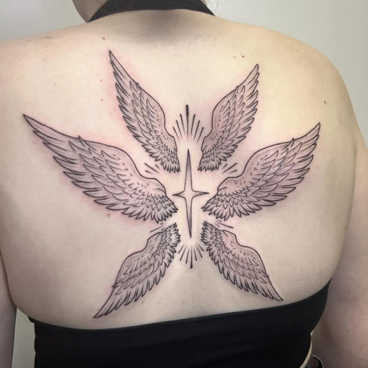 Big Blackwork Angel Wings and Star Tattoo on Women Back by @sweetcarolinetattoo