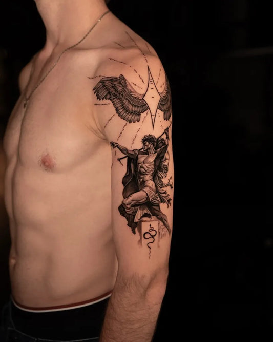 Big Blackwork Angel with Wings and Rays Tattoo on Men Upper Arm by @oliveragergaard