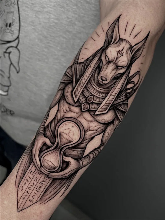 Big Blackwork Anubis Hourglass Wings Tattoo on Men Arm by @roco_tattoo