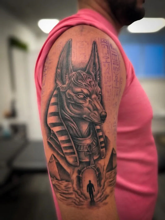 Big Blackwork Anubis with Pyramids and Figure Tattoo on Men Arm by @tomfitchtattoos