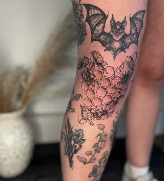 Big Blackwork Bat Flowers Bees Tattoo on Women Knee by @seed.eternal