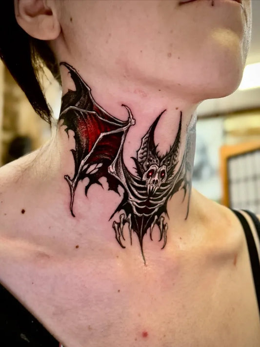 Big Blackwork Bat Wings Tattoo on Women Neck by @lustandconsume