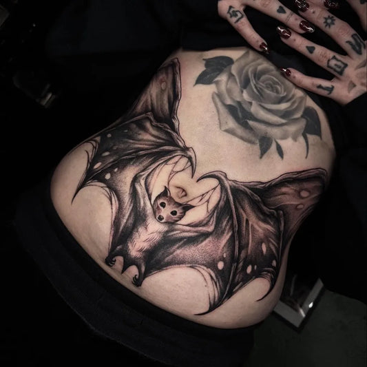 Big Blackwork Bat and Rose Tattoo on Women Back by @hadesgravetattoos